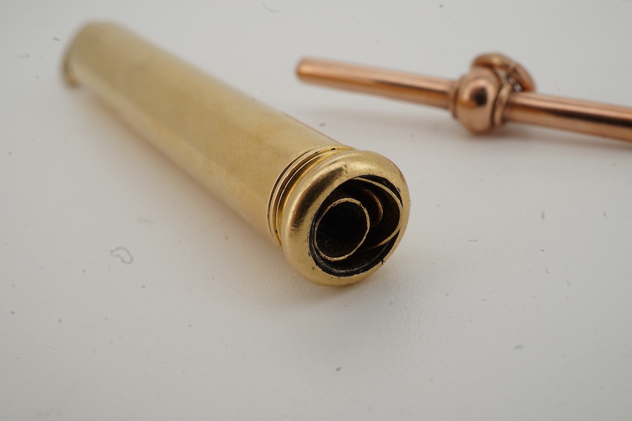S. Mordan, a gold-cased propelling pen and gold fob, early 20th century, the gold pen with retractable holster for fountain pen nibs, maximum length 11.3cm, signed S. Mordan, gross weight 17 grams; and a gold T-bar fob p